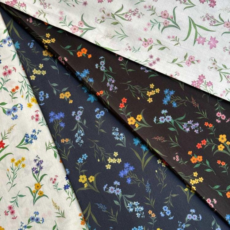 The image is a collage of four fabric swatches, each with a different floral pattern. The swatches include a white fabric with a floral pattern, a dark fabric with a floral pattern, a black fabric with a floral pattern, and a fabric with a colorful floral pattern.