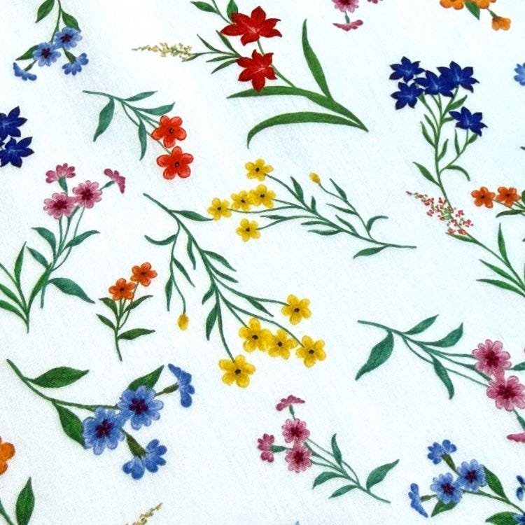 a variety of colorful flowers and leaves, including red, blue, yellow, and pink flowers, as well as green leaves, arranged in a visually appealing and intricate manner.