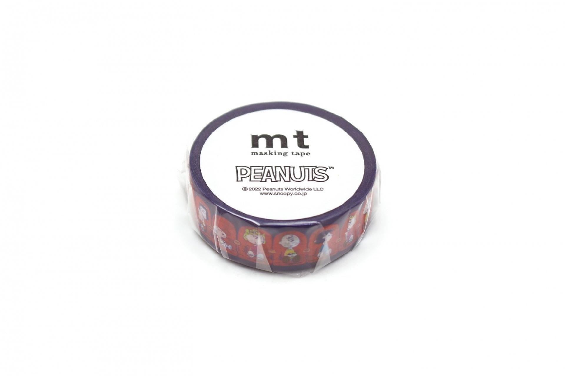 A round, purple-colored masking tape roll with the word "Peanuts" printed on it.