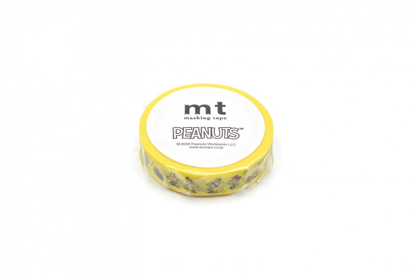 A yellow and white circular object with the text "Peanuts" printed on it.