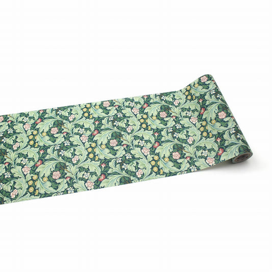 a roll of paper with a floral pattern on it, placed on a white background.