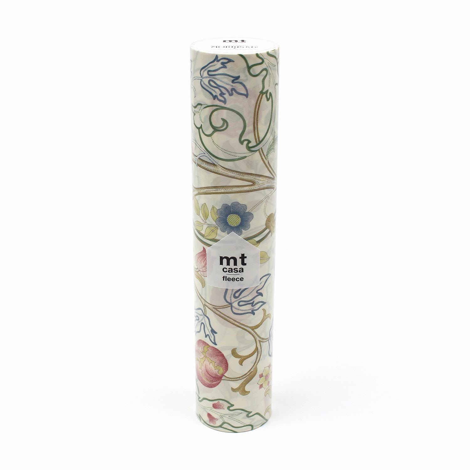 A cylindrical object with a floral pattern on it, featuring a white label with text.