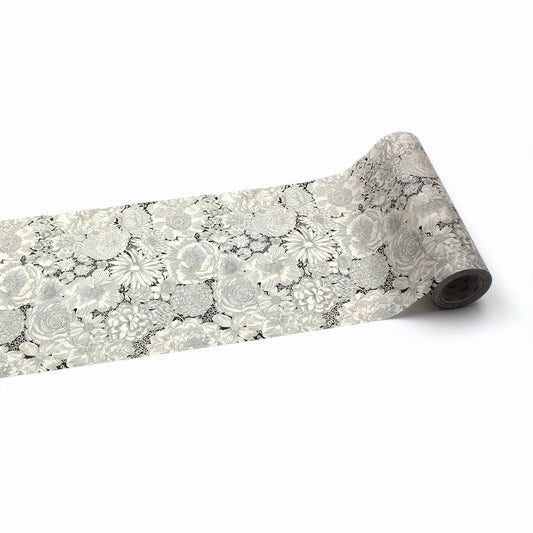 a roll of paper with a floral pattern on it, placed on a white background.