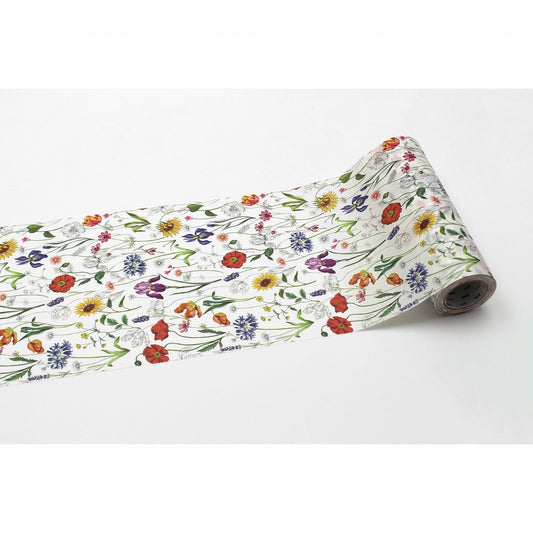 A roll of paper with a floral pattern on it, featuring various colorful flowers and leaves.