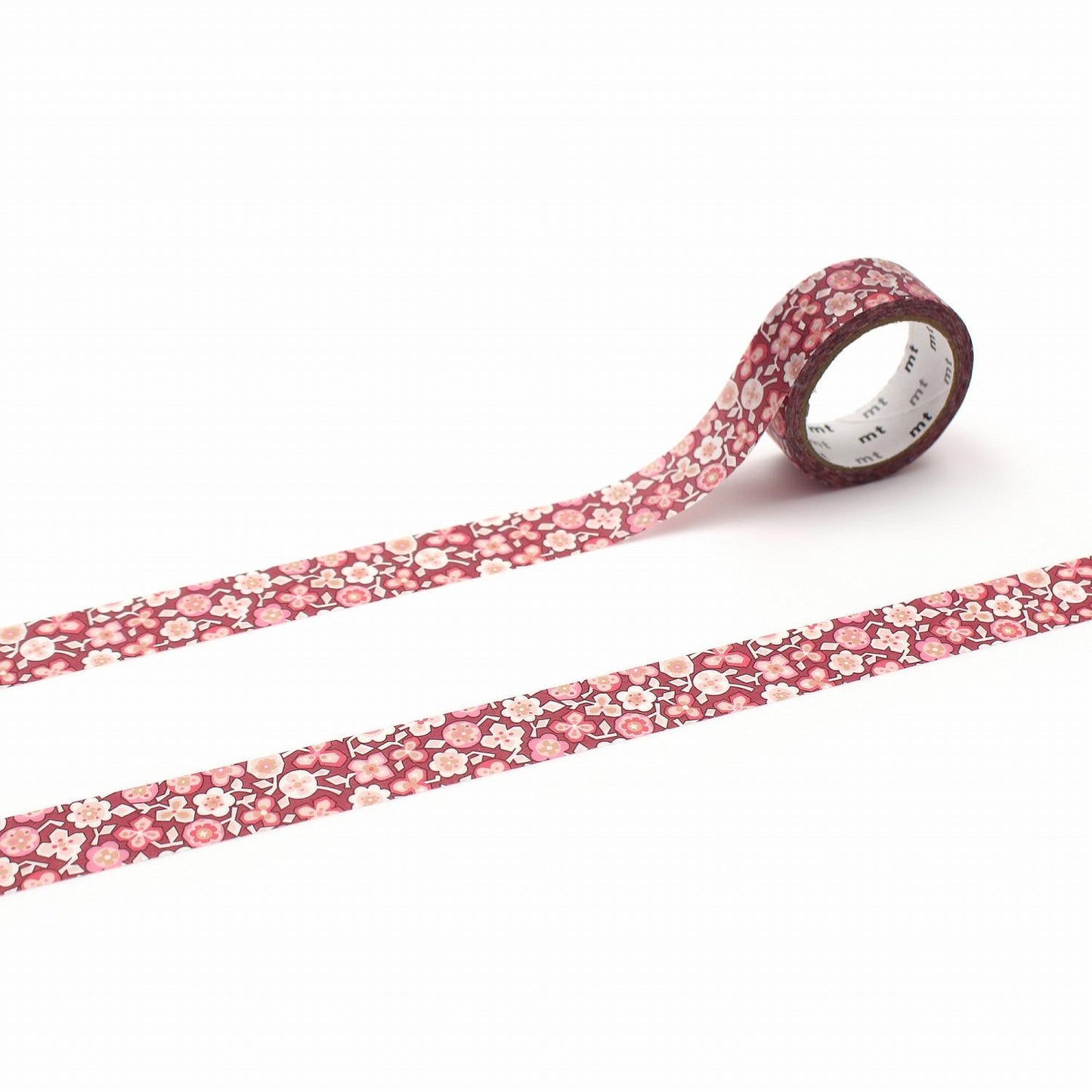 a roll of red and white floral patterned tape on a white background.