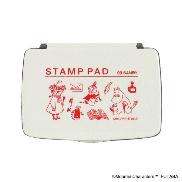 The image is a stamp pad featuring various cartoon characters, including Moomin characters, and it is white in color.
