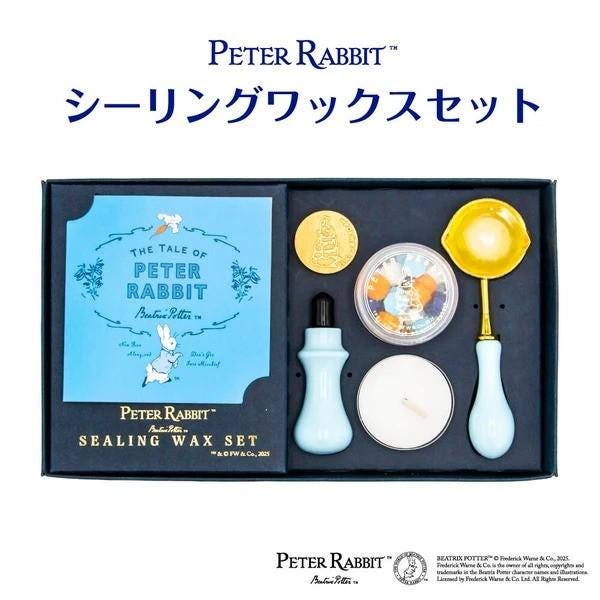 The image is a promotional poster for a Peter Rabbit sealing wax set. It features a blue box with the title "The Tale of Peter Rabbit" and a gold seal, along with various items such as a gold coin, a gold spoon, and a gold candle.