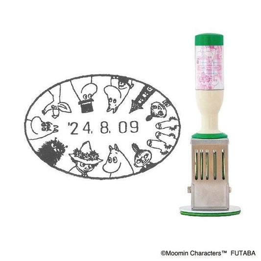 a stamp with a circular design and a bottle with a green cap, both placed next to each other.