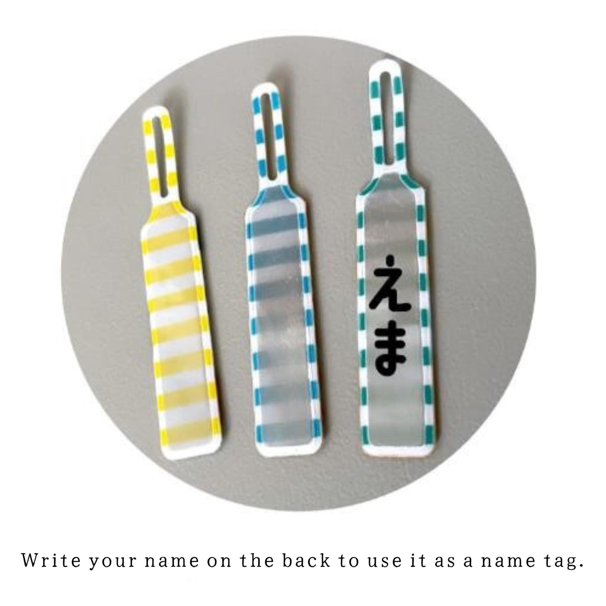 three colorful paddle-like objects with different designs and patterns, arranged in a circular manner.