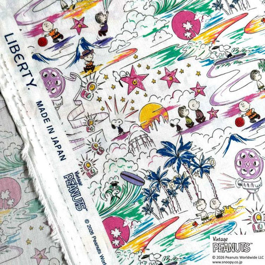 The image is a vibrant and colorful fabric with a variety of cartoon characters and illustrations, including Snoopy, Charlie Brown, and other Peanuts characters, as well as tropical elements like palm trees and a beach scene.