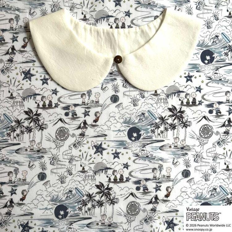 a white collar with a button, placed on a background with a pattern of various cartoon characters and illustrations.
