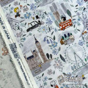 The image is a collage of various illustrations and scenes, including a clock tower, a ferris wheel, a car, and other elements, all set against a floral background.