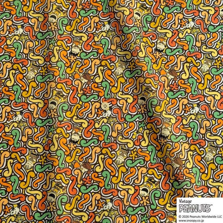 The image is a collage of various colorful and abstract patterns, including swirls, curves, and shapes in shades of orange, yellow, green, and black.