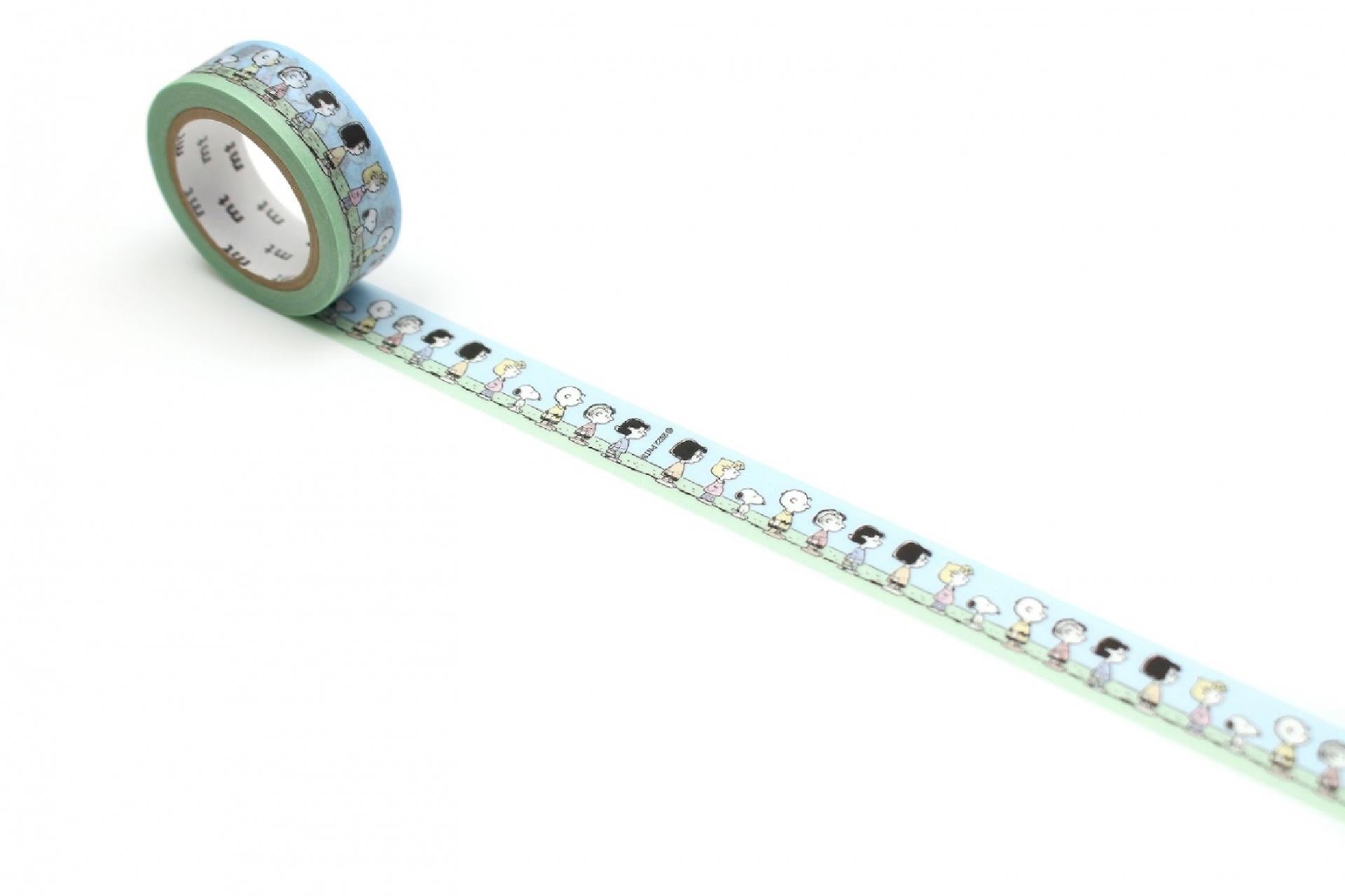 A roll of light blue and green patterned tape with a repeating design of cartoon-style people on it.