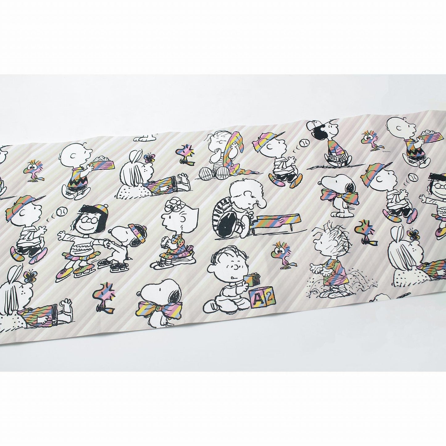 a collage of various cartoon characters, including Peanuts, arranged in a repeating pattern.