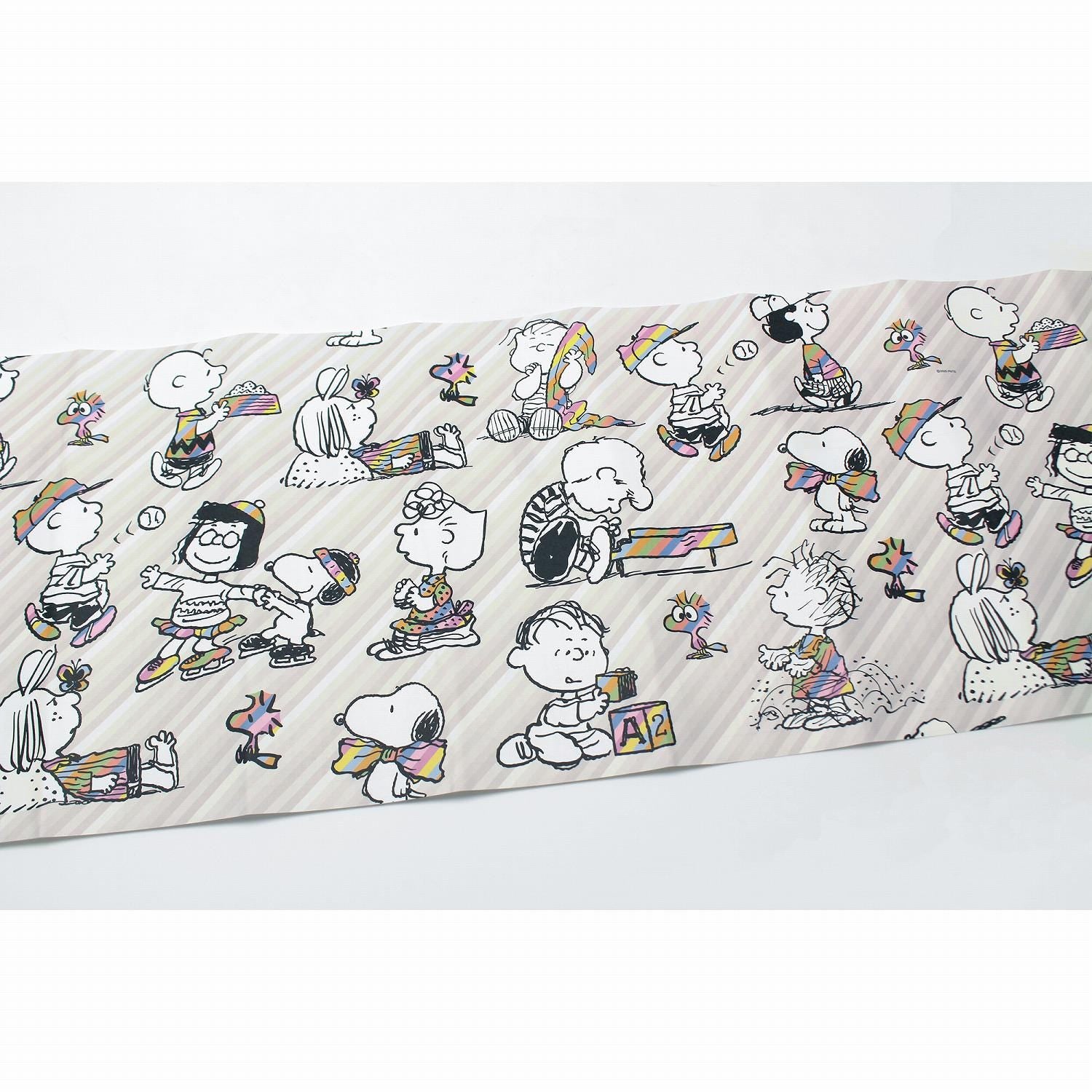 a collage of various cartoon characters, including Peanuts, arranged in a repeating pattern.