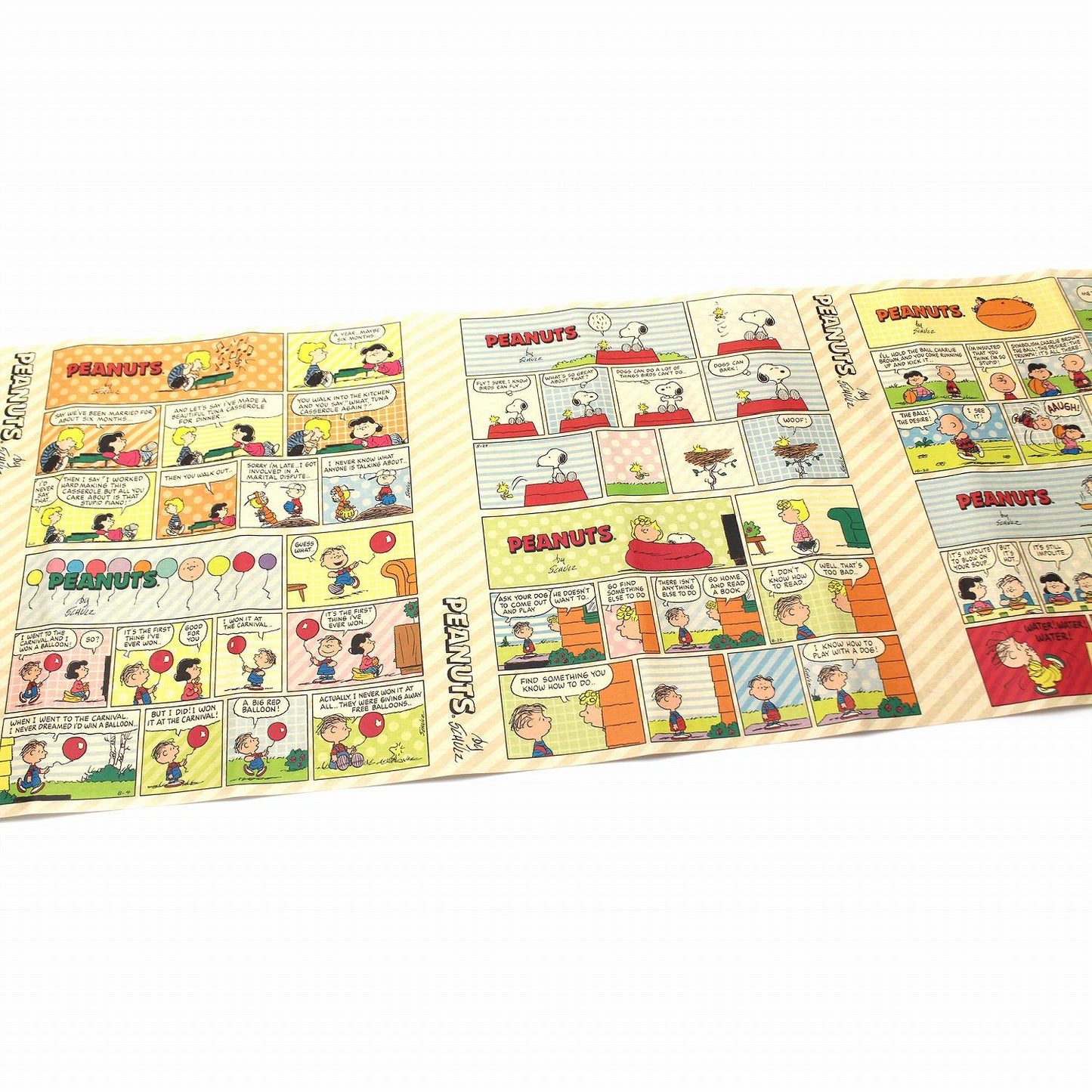 The image is a collage of various Peanuts comic strip panels, featuring characters such as Snoopy, Charlie Brown, and other beloved Peanuts characters.