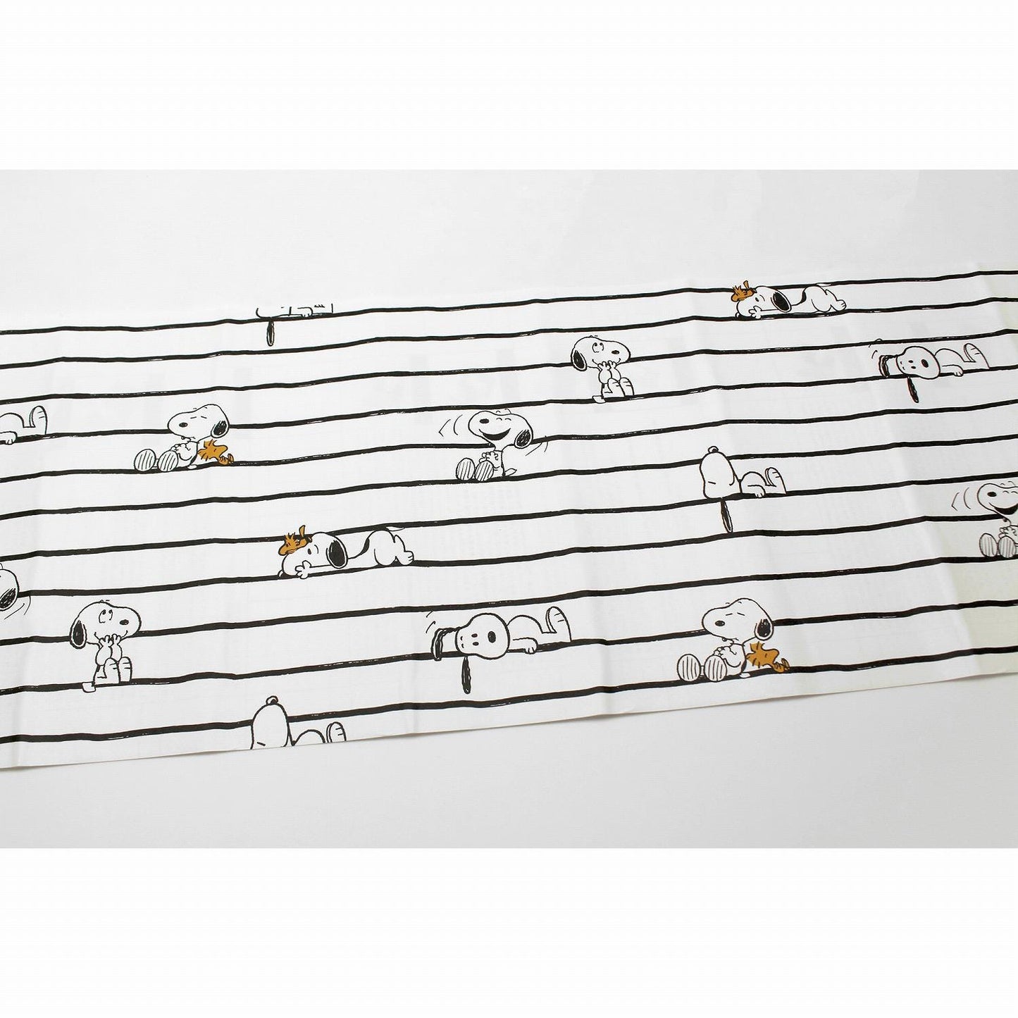 a repeating pattern of cartoon characters, including Snoopy, arranged in a grid-like layout.