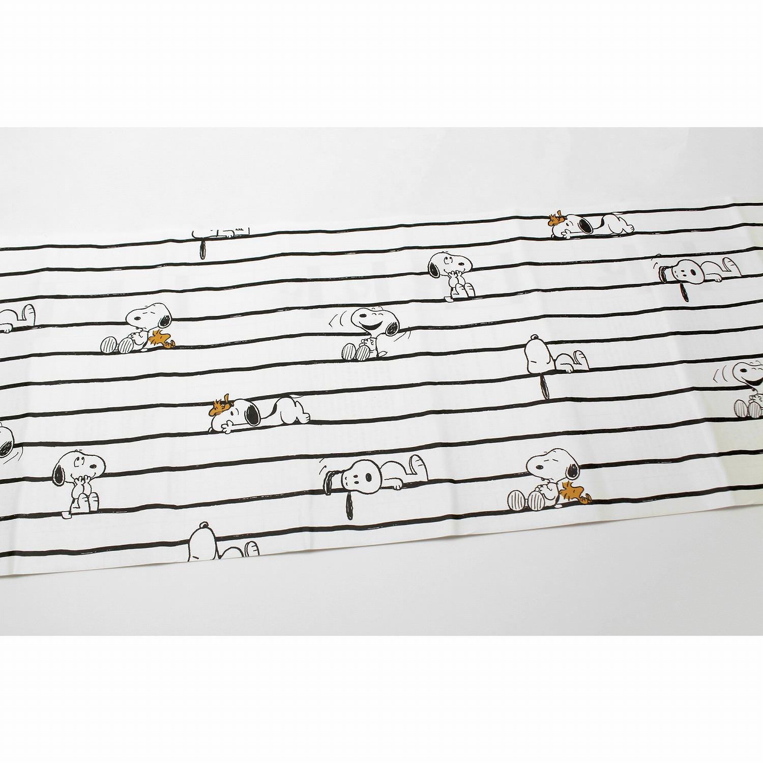 a repeating pattern of cartoon characters, including Snoopy, arranged in a grid-like layout.