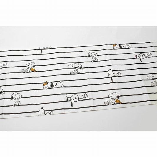 a repeating pattern of cartoon characters, including Snoopy, arranged in a grid-like layout.