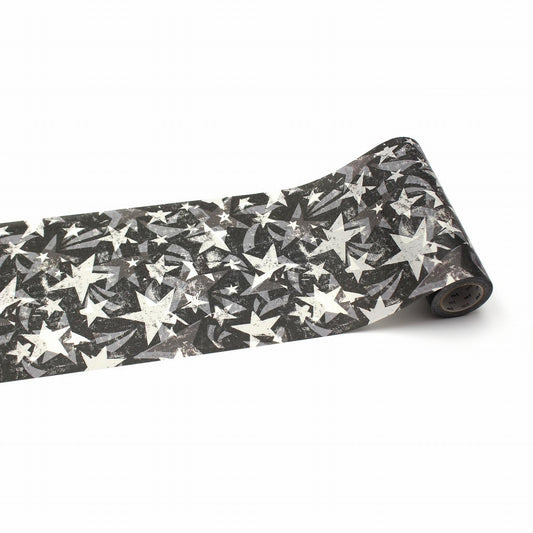 A roll of black and white star-patterned tape is shown against a white background.