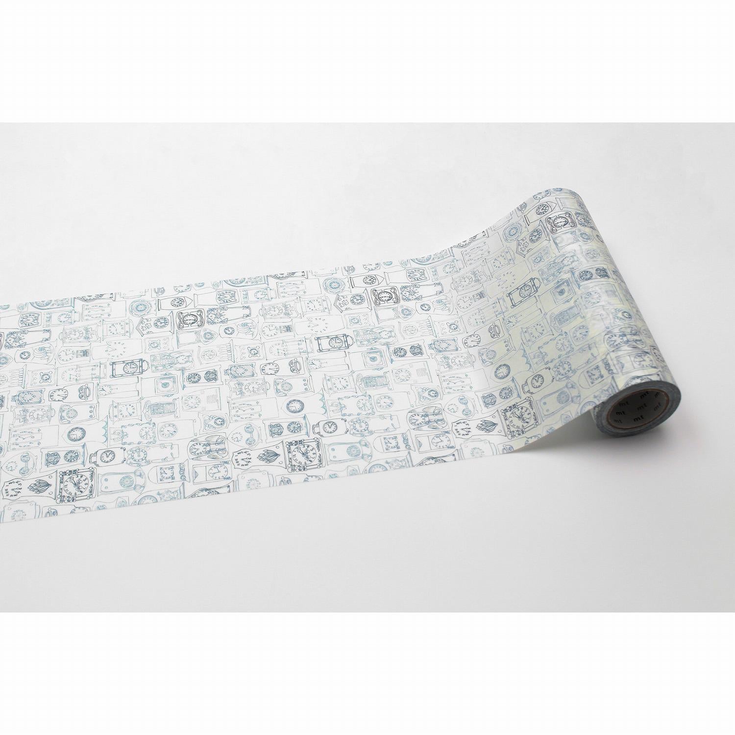 a roll of paper with a repeating pattern of various objects and designs, including gears, circles, and other abstract shapes.