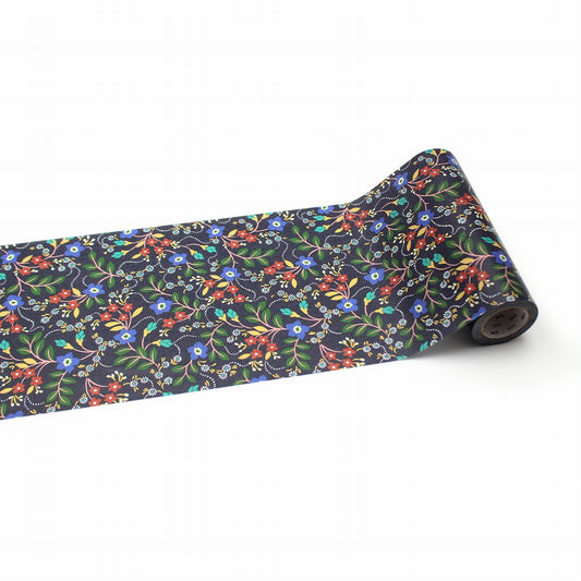 A roll of decorative paper with a floral pattern on it.