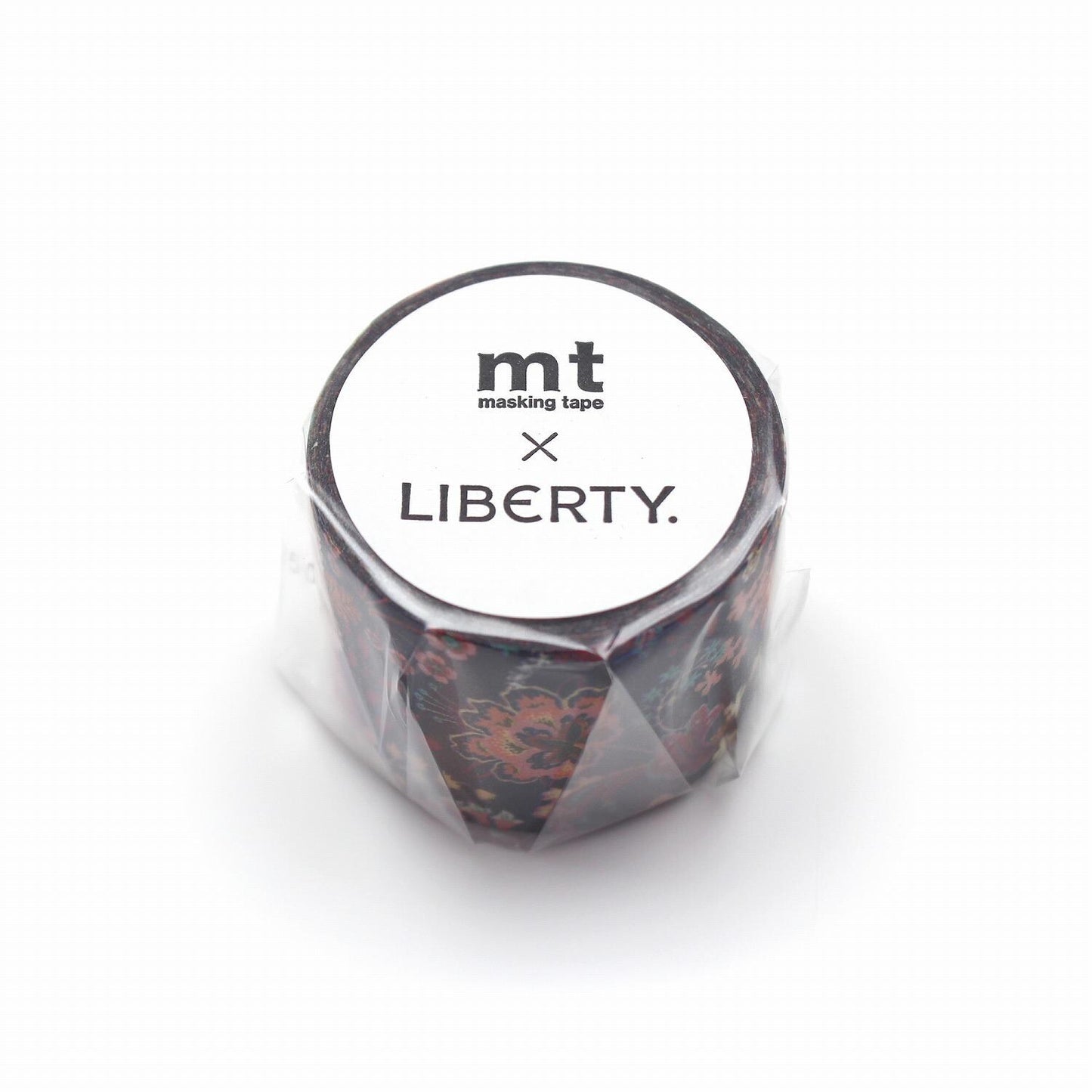 A cylindrical object with a floral pattern, wrapped in plastic and labeled with the text "mt masking tape LIBERTY."
