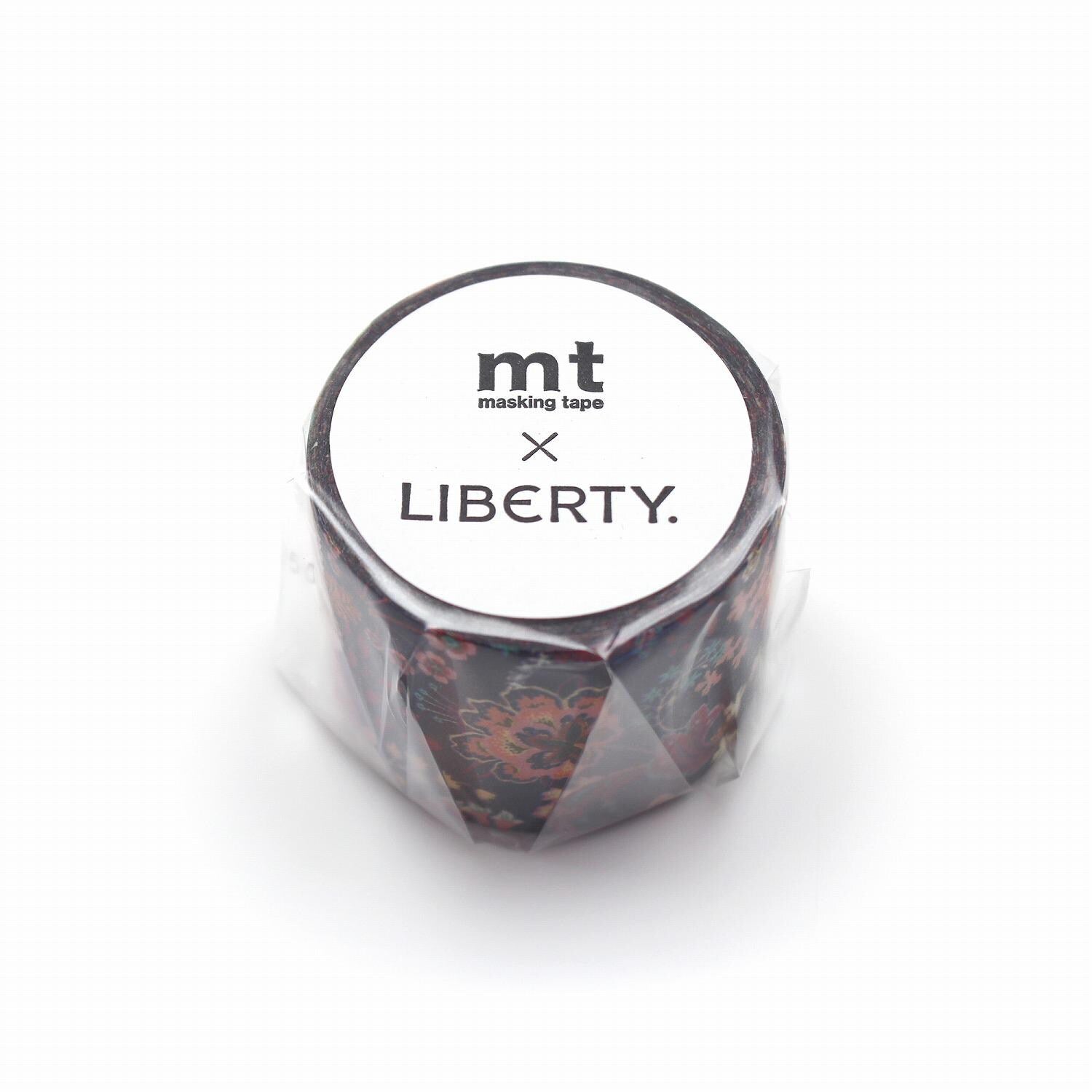 A cylindrical object with a floral pattern, wrapped in plastic and labeled with the text "mt masking tape LIBERTY."