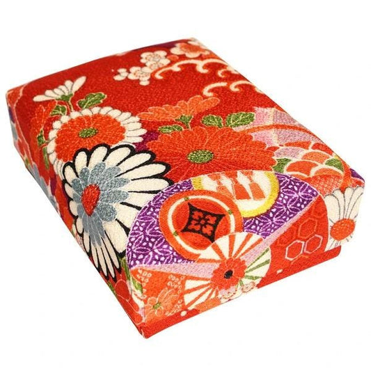 a vibrant, colorful box with a floral pattern.