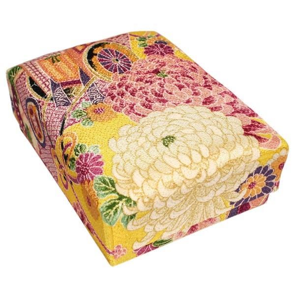 a colorful, patterned box with a floral design.