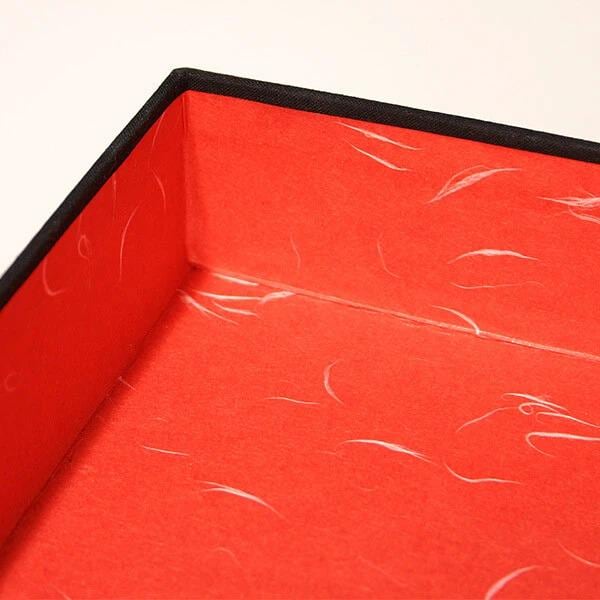 an open red box with a black border, revealing a red interior.