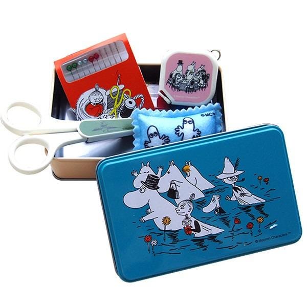 a collection of various items, including a pair of scissors, a tin can, and a small box, all featuring illustrations of Moom characters.