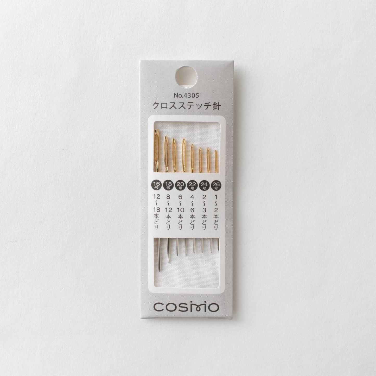 A package of sewing needles with a series of numbered needles displayed in a grid.