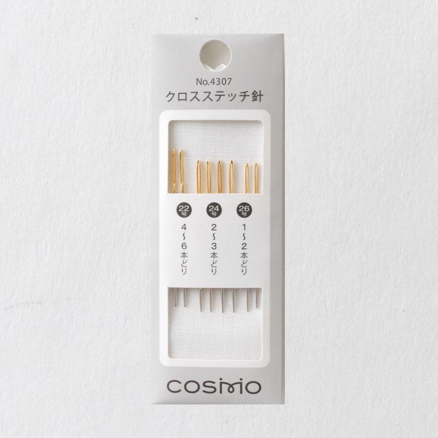 A package containing a set of knitting needles with the brand name 'cosimo' printed on it.