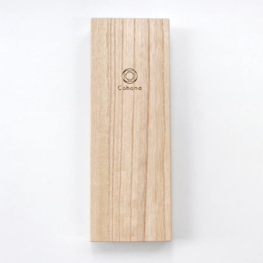 A wooden box with the word "Cohana" printed on it.