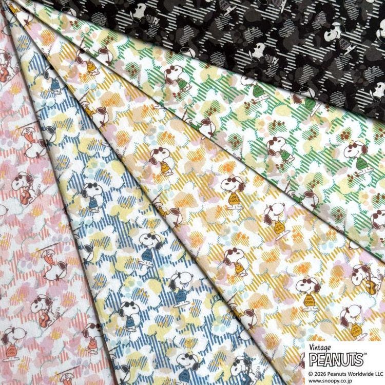 The image is a collage of various fabric swatches featuring the iconic Peanuts characters, including Snoopy, Woodstock, and Charlie Brown.