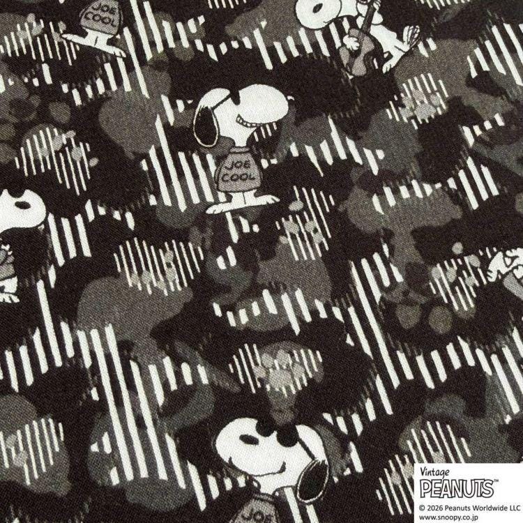 a repeating pattern of cartoon characters, including Snoopy, Joe Cool, and other iconic Peanuts characters, against a camouflage background.