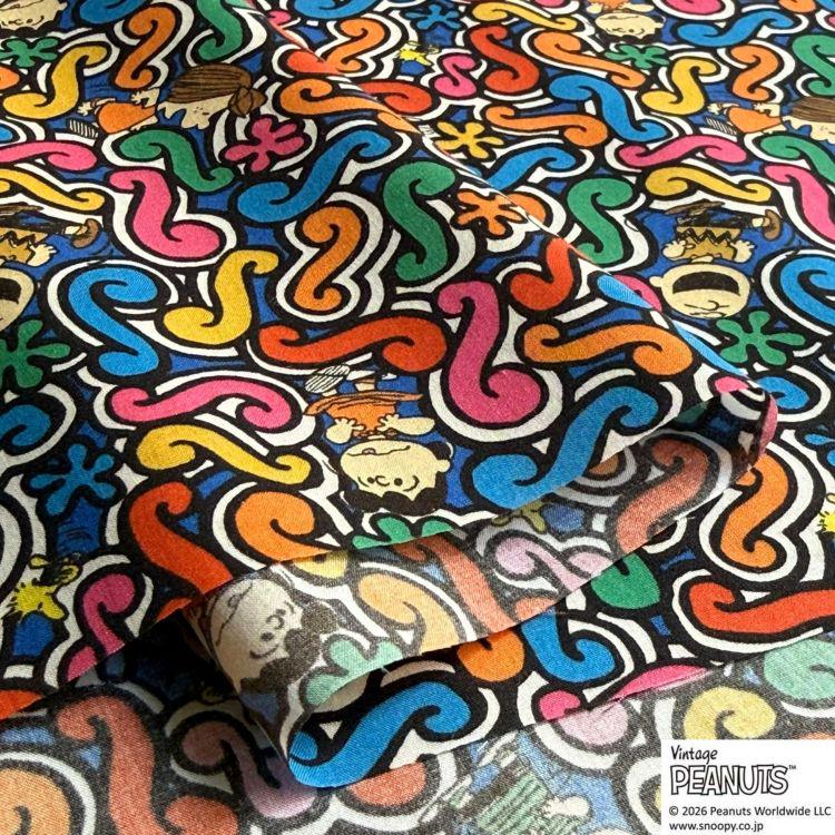 The image is a vibrant and colorful collage featuring a repeating pattern of various cartoon characters and shapes in a variety of bright and bold colors.