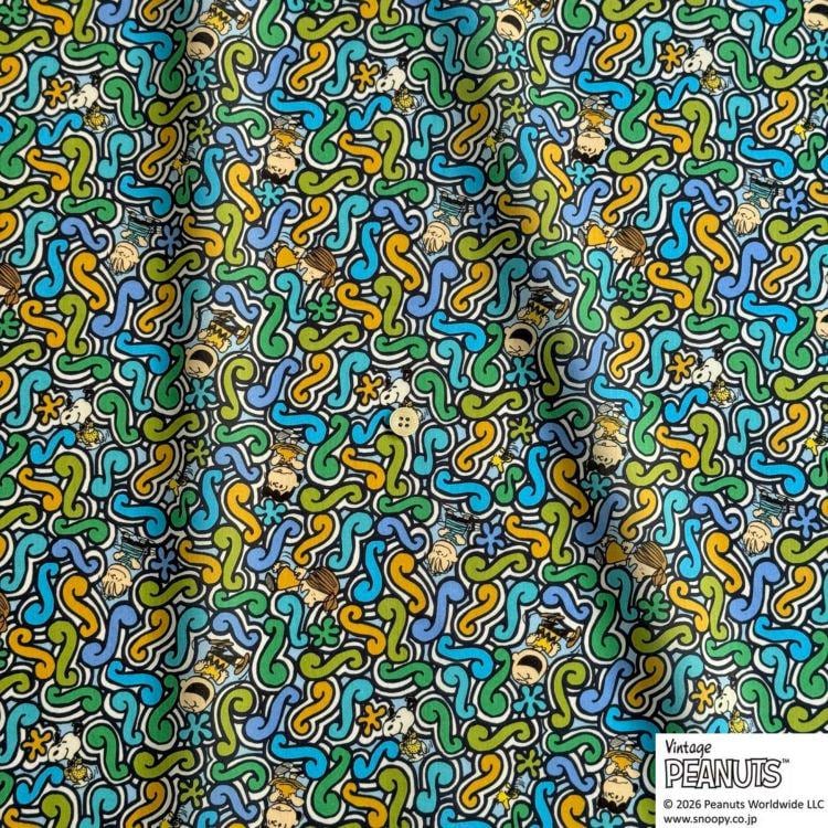 The image is a vibrant and colorful pattern featuring a repeating design of various shapes and colors, including swirls, curves, and geometric elements. The pattern appears to be a textile or fabric design, with the colors and shapes creating a visually striking and dynamic composition.