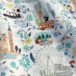 The image is a collage of various cartoon characters and scenes, including Peanuts characters, a ferris wheel, and other elements such as flowers and buildings.