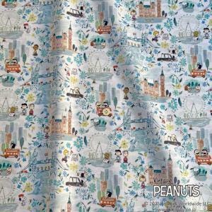 The image is a collage of various illustrations and scenes, including buildings, vehicles, and people, all set against a light blue background. The text "Peanuts" is visible, suggesting that this is a collection of Peanuts-themed illustrations.