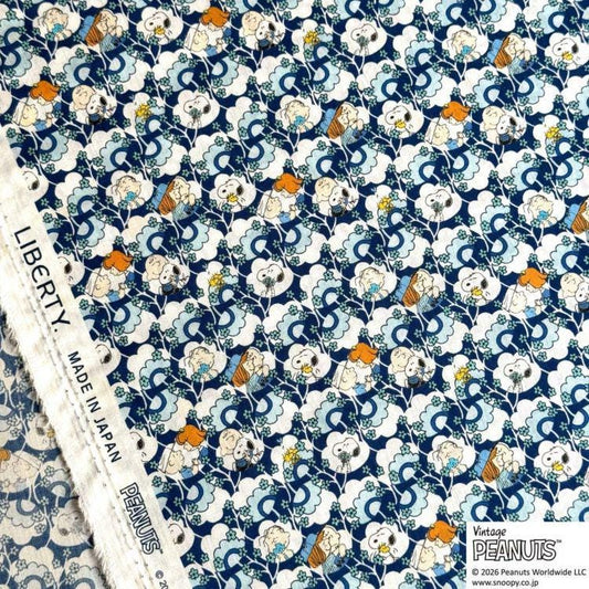 a repeating pattern of cartoon characters on a blue and white background.