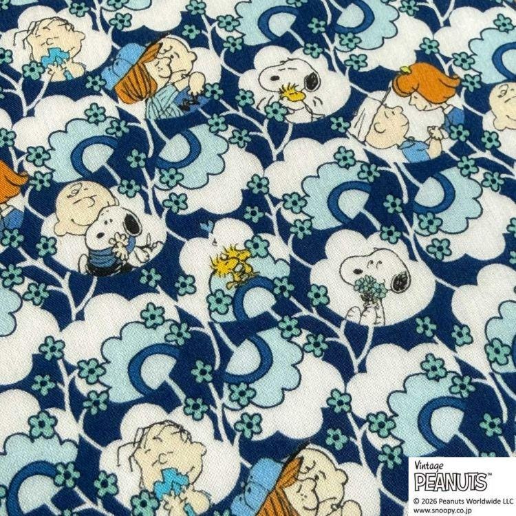 The image is a collage of various Peanuts characters, including Snoopy, Charlie Brown, and Woodstock, all depicted in a playful and colorful manner.