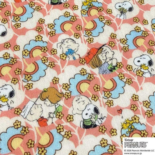 The image is a collage of various Peanuts characters, including Snoopy, Charlie Brown, and Woodstock, all set against a background of colorful flowers and clouds.