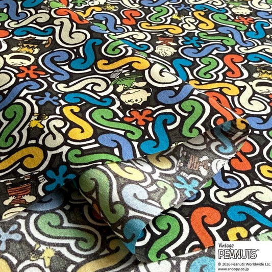 a vibrant and colorful pattern with various swirls, shapes, and characters, including Peanuts characters, creating a visually striking and playful design.