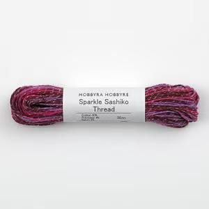 A spool of thread with a label that reads "Hobbyra Hobbyre Sparkle Sashiko Thread" and "50m".