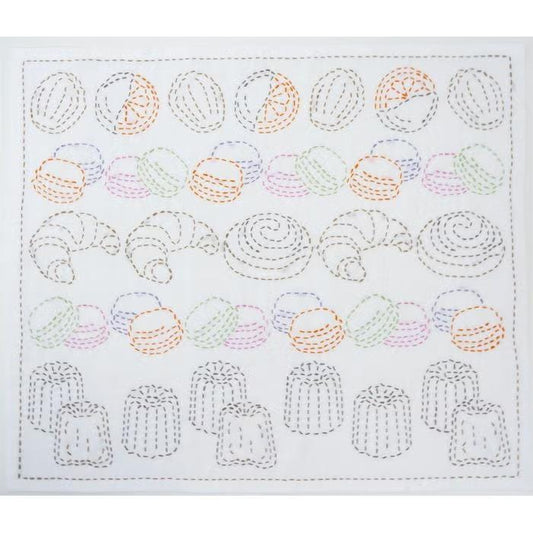 The image is a square with a repeating pattern of various food items, including croissants, macarons, and other pastries, as well as some fruits. The pattern is created using a sewing technique, with the food items and fruits depicted as small, circular shapes and the croissants and macarons as larger, dough-like shapes. The image does not contain any text or additional objects, and the arrangement of the food items and the sewing technique create a visually appealing and intricate design.