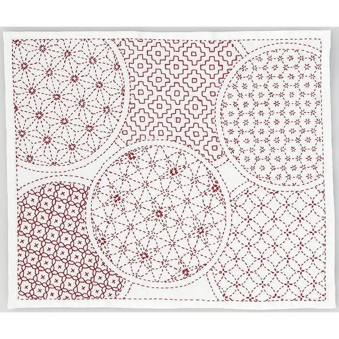 The image is a collage of various circular patterns and designs, featuring a mix of geometric and floral motifs. The patterns include a variety of shapes, such as circles, ovals, and diamonds, as well as floral elements like flowers and leaves. The overall composition creates a visually interesting and diverse display of circular designs.