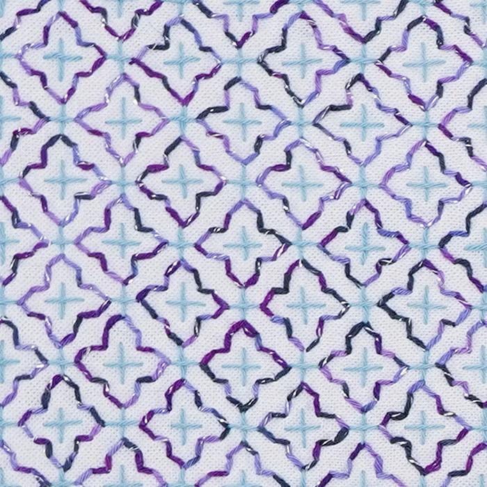 a repeating pattern of purple and blue diamond shapes arranged in a grid-like fashion.